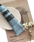 Aesop Reverence Aromatique Travel Size Hand Balm | Lotion that Gently Exfoliates Dry Hands + Nourishes with Macadamia Seed Oil and Shea Butter | 2.4 oz / 75 mL